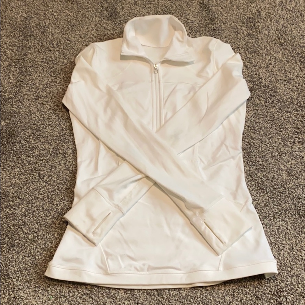 White LuluLemon pull over.